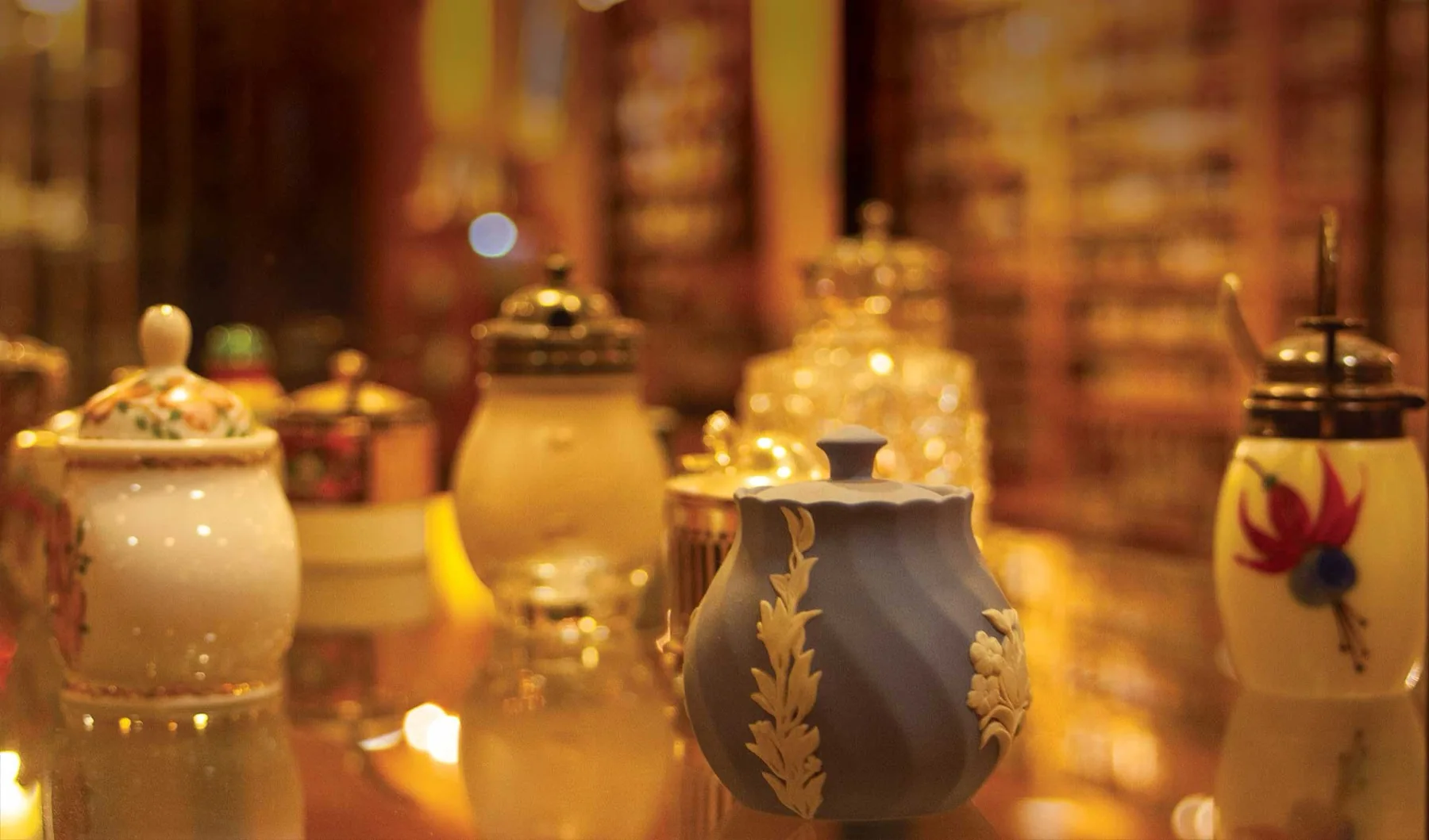 Porcelain, jasperware and silver, under the case lights.